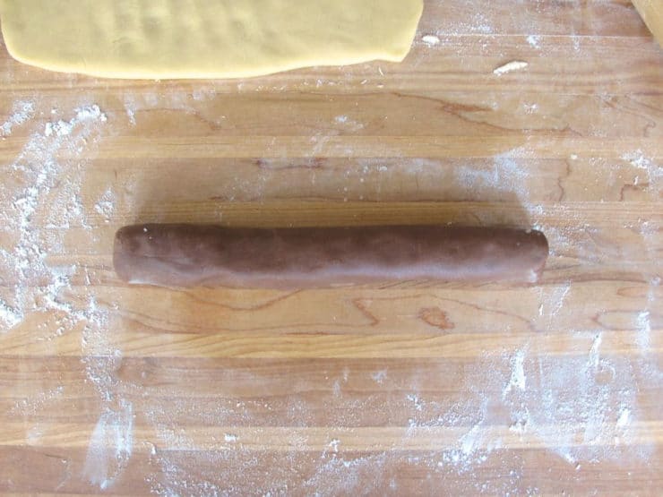 Roll chocolate dough into a small log.