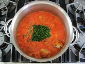 Parsley and seasonings added to paprikash pot.