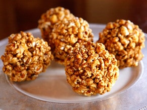 Vintage Popcorn Balls - Learn to make candied popcorn balls the old fashioned way. A vintage treat for Halloween, carnivals, festivals, or just because!