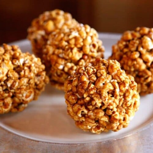 Vintage Popcorn Balls - Learn to make candied popcorn balls the old fashioned way. A vintage treat for Halloween, carnivals, festivals, or just because!