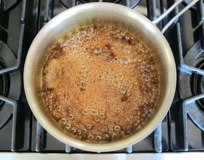 Boiling syrup in a small pot.