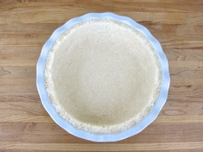 Press macaroon crust into a pie plate.
