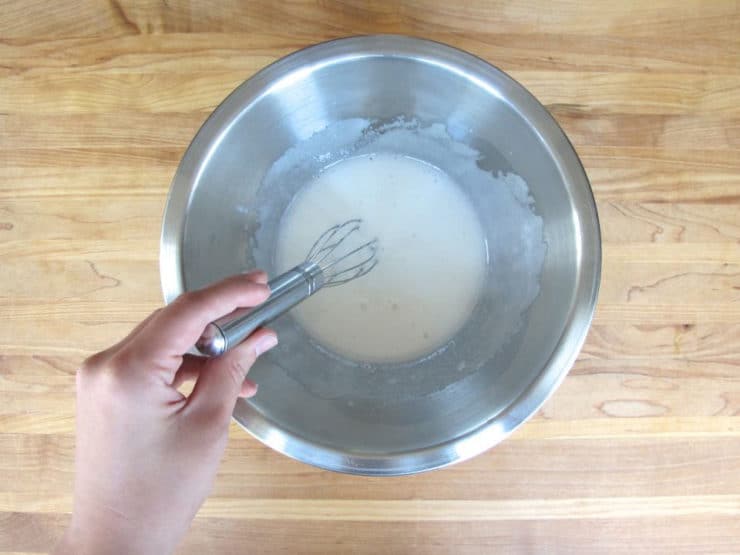 Whisked egg whites in a large bowl.