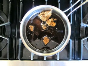 Brown sugar and water in a small pot.