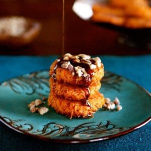 Stack of sweet potato cookies served with Brown Sugar Syrup and Cayenne Candied Pecans