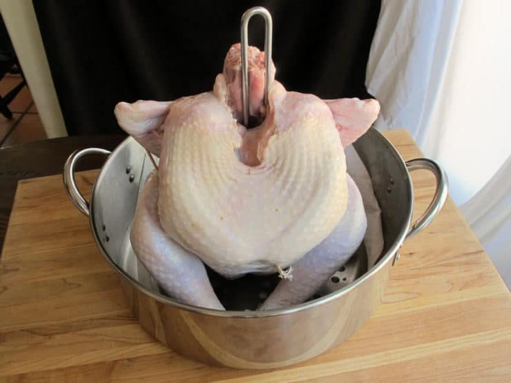 Attach turkey to fryer handle per instructions.