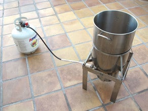 Set up the turkey fryer on a clean, level surface.