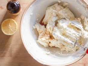 Cream cheese and butter in a mixing bowl to make frosting.