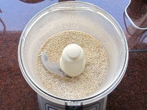Matzo crisp topping ingredients in a food processor bowl.