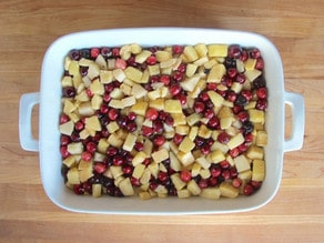 Apple cranberry filling spread in a baking dish.