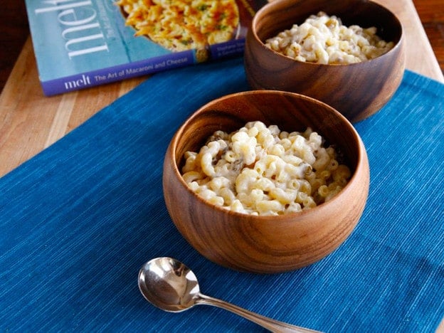 A delectable dish from Melt, combining creamy Gouda cheese, sweet raisins, and crunchy pine nuts