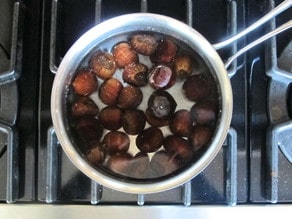 Chestnuts in a pot of water.