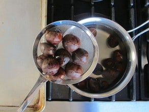 Draining chestnuts.