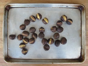 Chestnuts on a baking sheet.