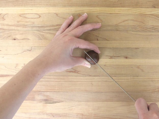 Slicing chestnuts.