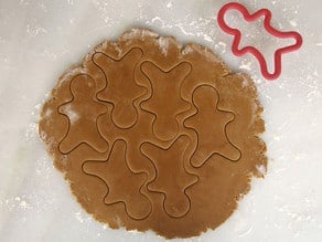 Cutting out gingerbread men.