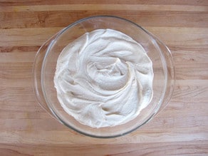 Hummus spread in a serving bowl.