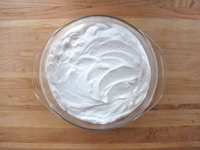Greek yogurt spread over hummus.