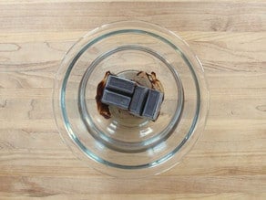 Melting chocolate over hot water.