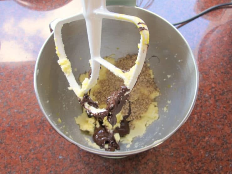 Stirring melted chocolate into butter.