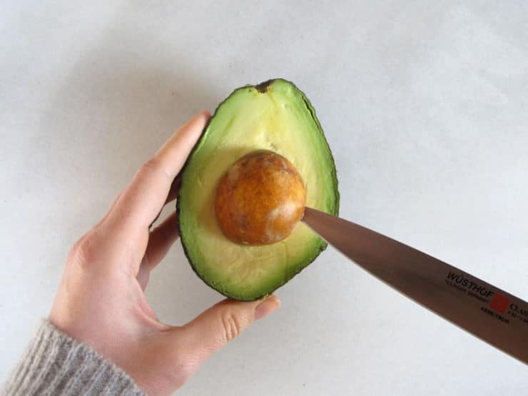 Removing an avocado pit.