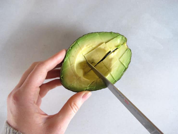 Dicing an avocado in the peel.