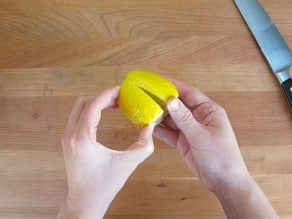 Lemons sliced most of the way through.