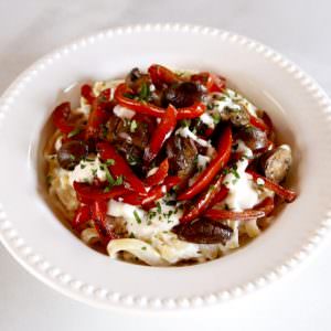 A delicious dish featuring sautéed mushrooms and peppers tossed with pasta