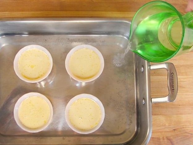 Setting up a water bath for custard cups.