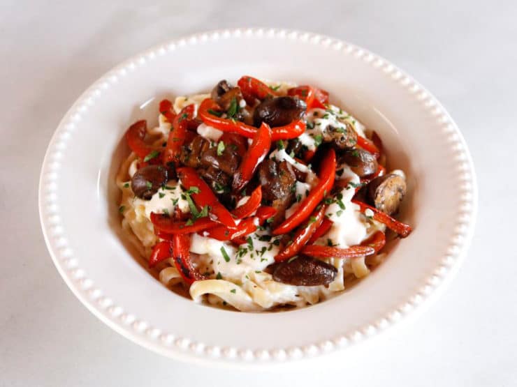 Mushroom Pepper Pasta with Feta Goat Cheese Sauce - Recipe for fettuccine pasta tossed with a creamy feta goat cheese sauce, topped with seared mushrooms and bell peppers. Flavorful, easy weeknight meal.