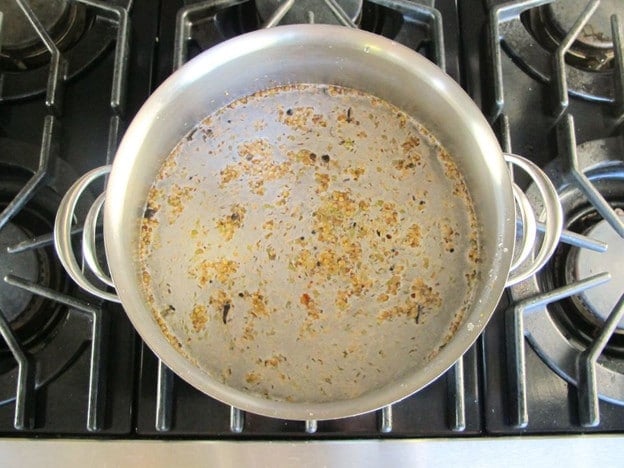 Preparing brine in a stockpot.