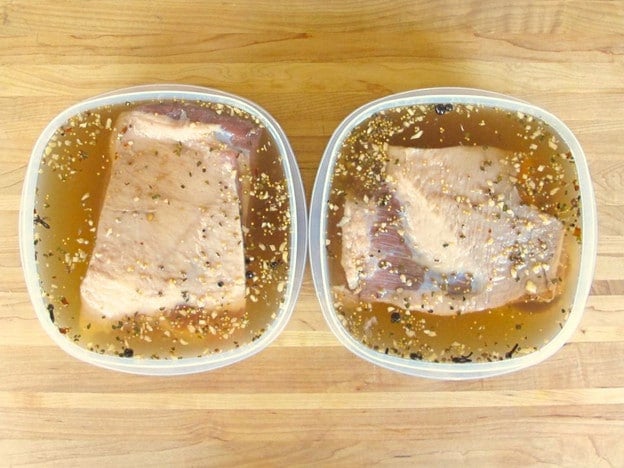 Submerging brisket in brine.
