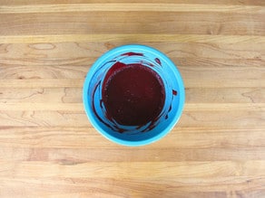 Red food coloring stirred into cocoa powder.