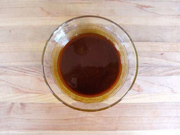 Chicken wing marinade whisked together in a bowl.