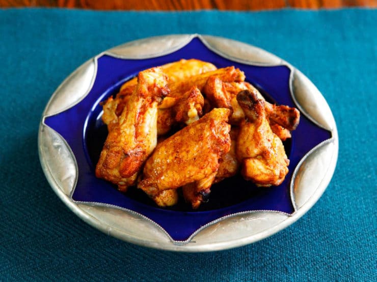 Spicy Middle Eastern Chicken Wings with Creamy Tahini Sauce - Baked, not fried. Lightened up, flavorful alternative to buffalo wings.