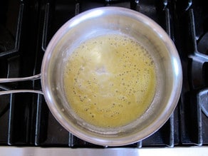 Making a roux in a saucepan.