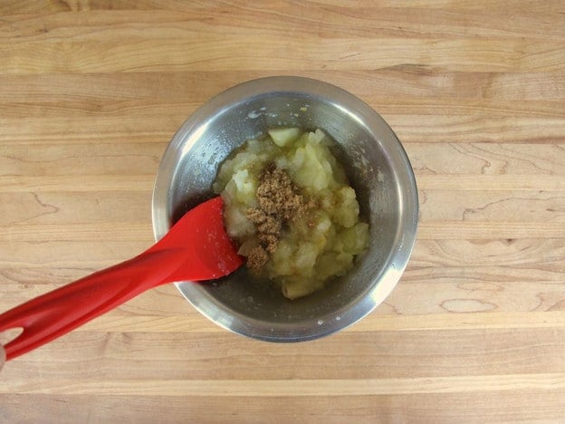 Mixing apple filling for puffs.