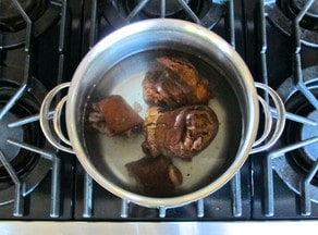 Ham hocks in boiling water.