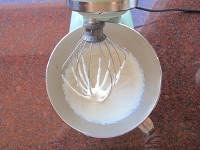 Whipping ricotta in a mixer.