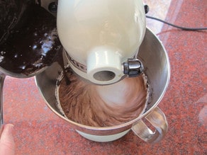 Mixing melted chocolate into ricotta cheese.