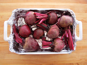 Beets in a foil lined pan to roast.