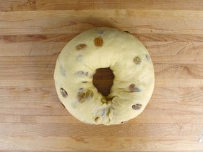 Bread dough into a donut shape.