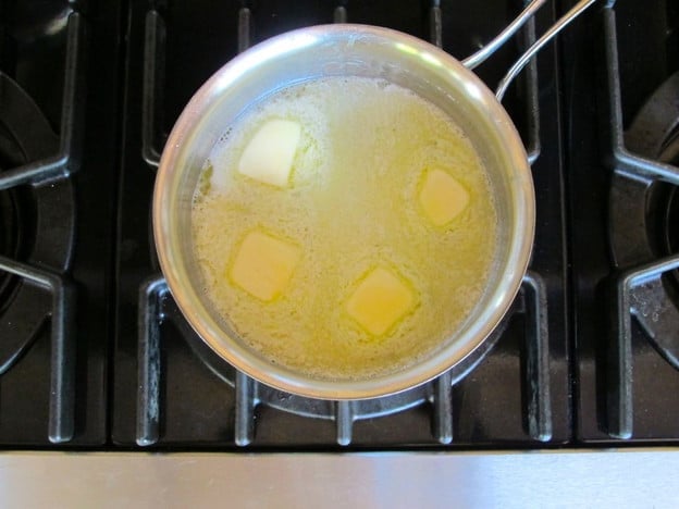 Melted butter in a small pot.