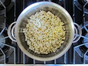 Popped popcorn in a deep pot.