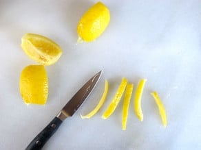 Chopping preserved lemon peels.