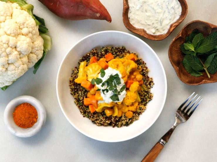 Vegetable Curry Quinoa Bowl - Recipe for creamy Indian-Style curry with cauliflower, sweet potato and chickpeas, over mint and parsley quinoa. Vegan or Vegetarian.