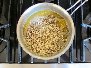Cooking quinoa in vegetable stock.