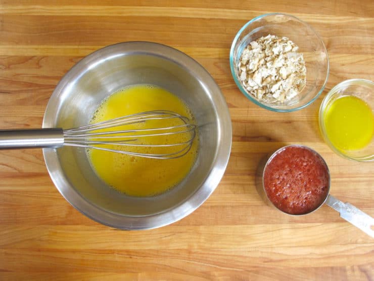 Whisked eggs in a mixing bowl.