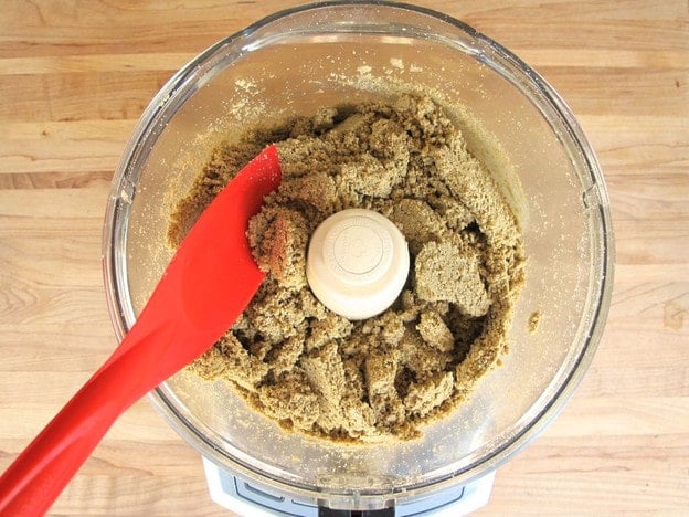 Breaking up clumps of sunflower seeds in a food processor.