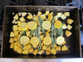 Lemon and rosemary spread over diced potatoes.